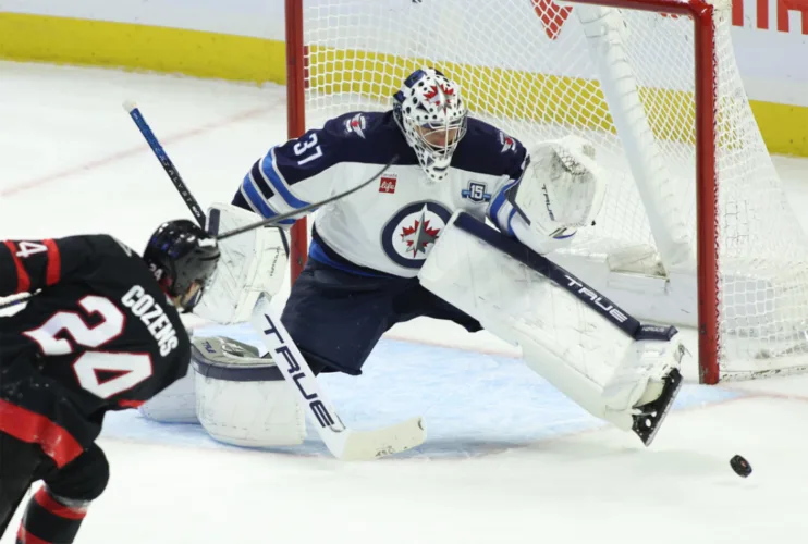 Devils acquire Hellebuyck in trade with Jets